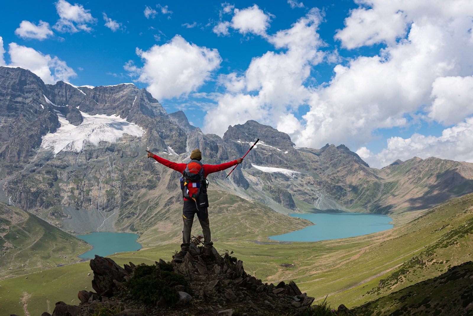 Happy trekkers posing with a stunning lake view